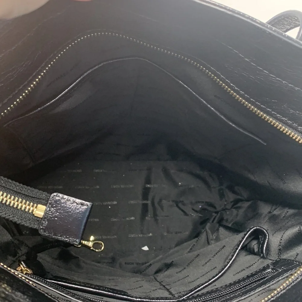 Michael Kors a black Vertical Tote.